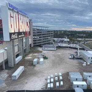 Large lot outside a football stadium with the modular temporary offices set up in rows.
